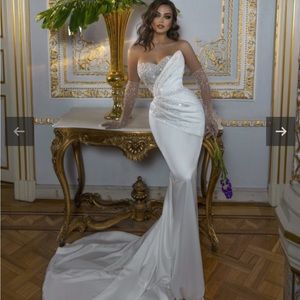 Dovita wedding dress. Never worn, no alterations! Comes with train,gloves,veil.